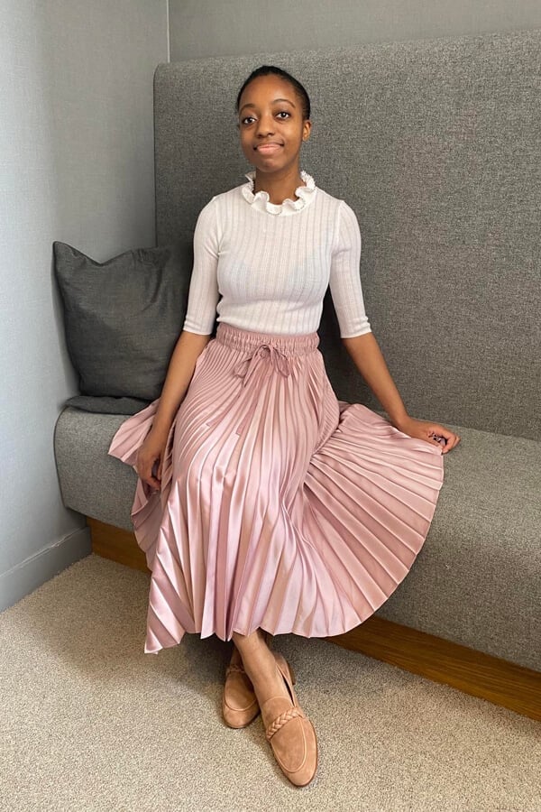 A white ribbed knit top with a ruffled collar and pale pink satin midi A white ribbed knit top with a ruffled collar and pale pink satin midi — Feminine Style