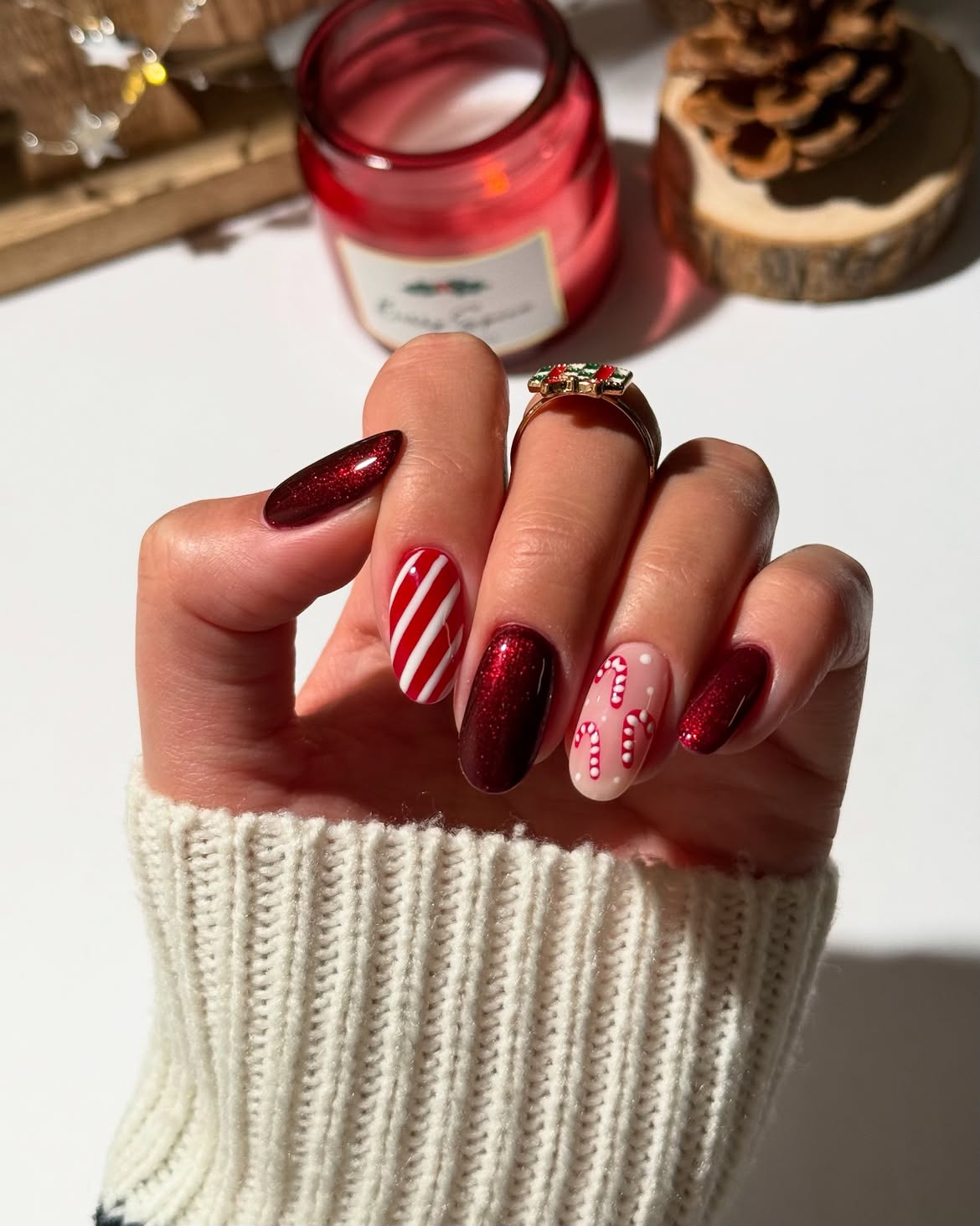 Festive Candy Cane and Glitter Christmas Almond Nails