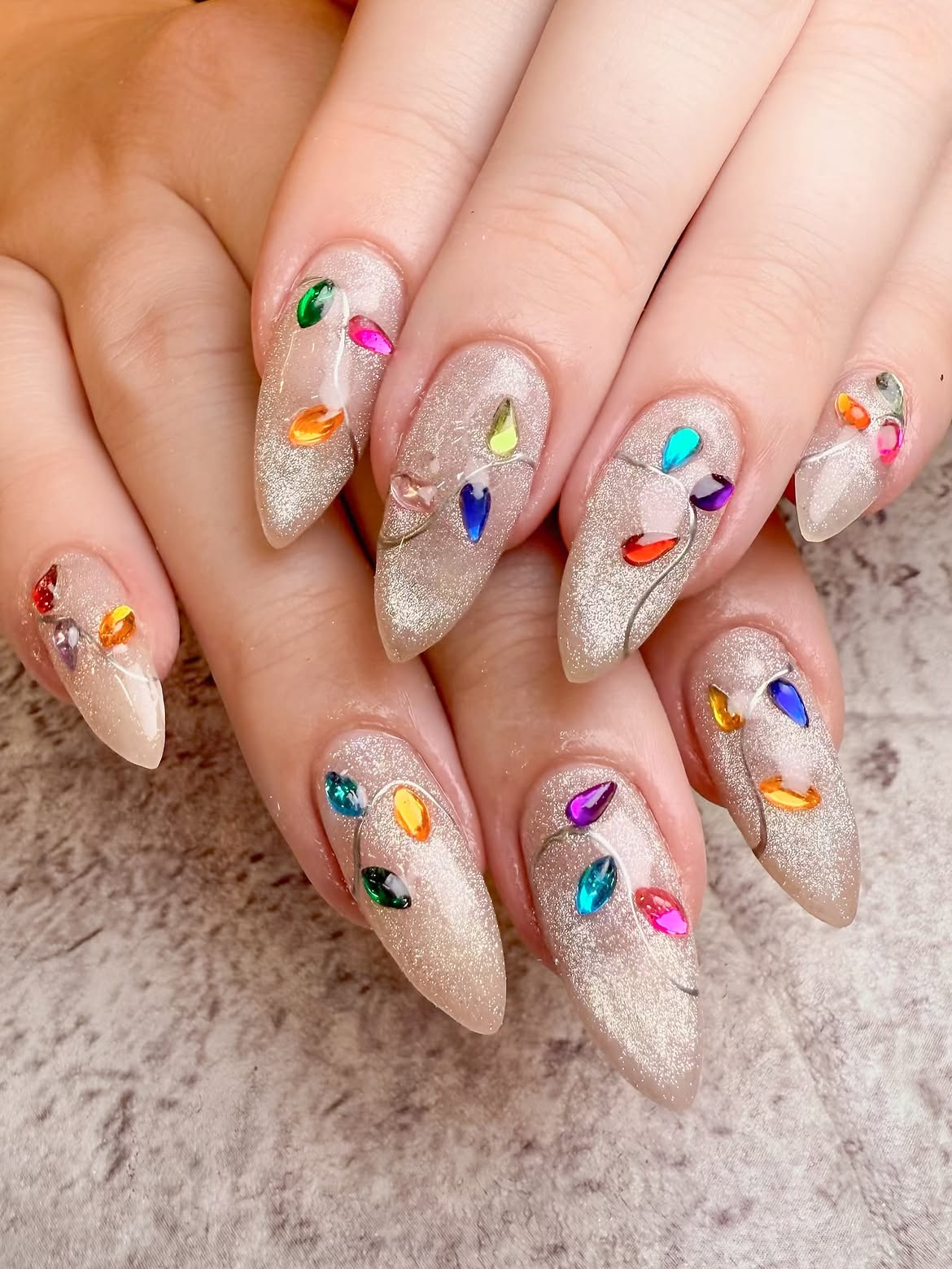 Festive Cat Eye Christmas Lights Almond Nails