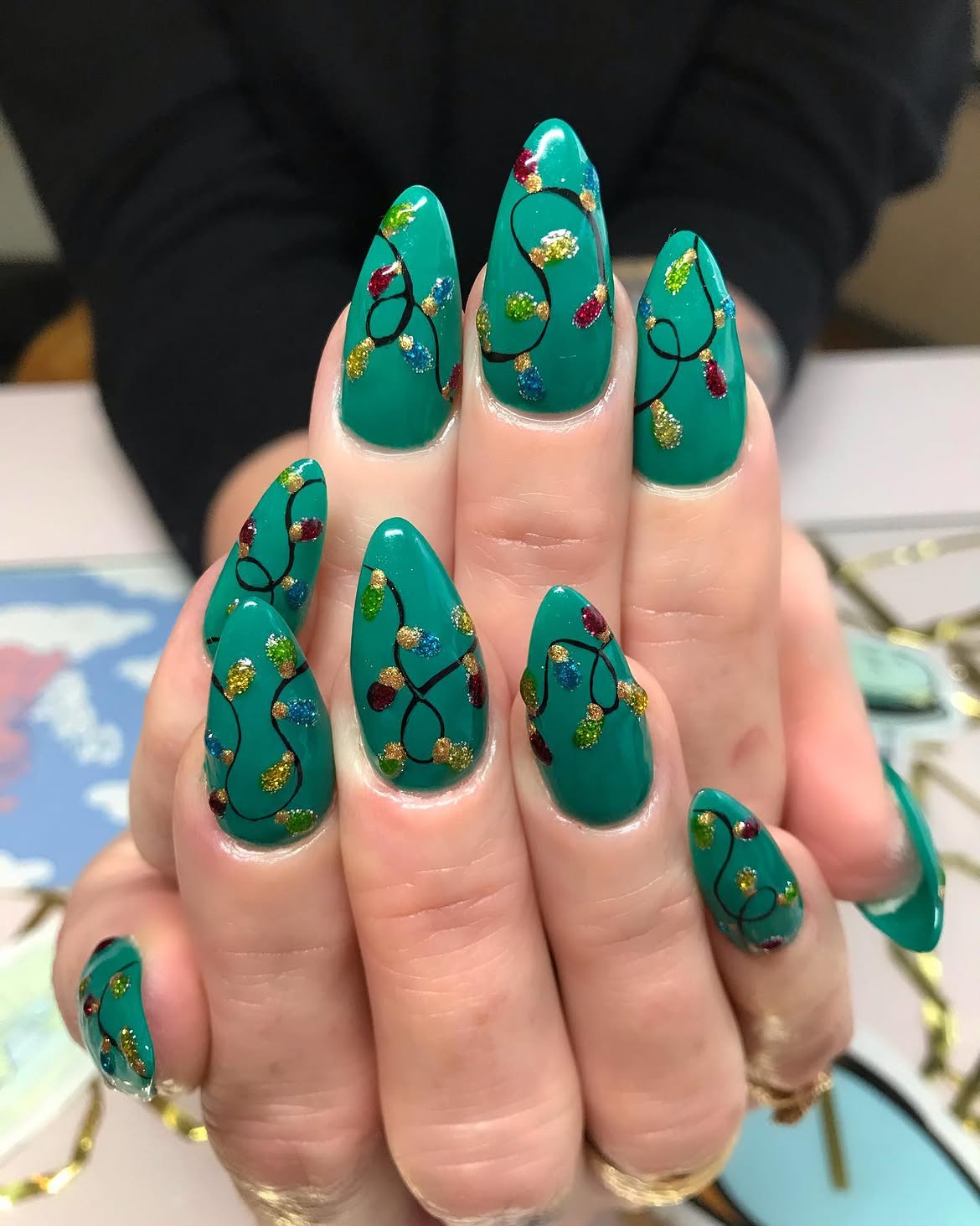 Festive Green Stiletto Nails With Christmas Lights Art