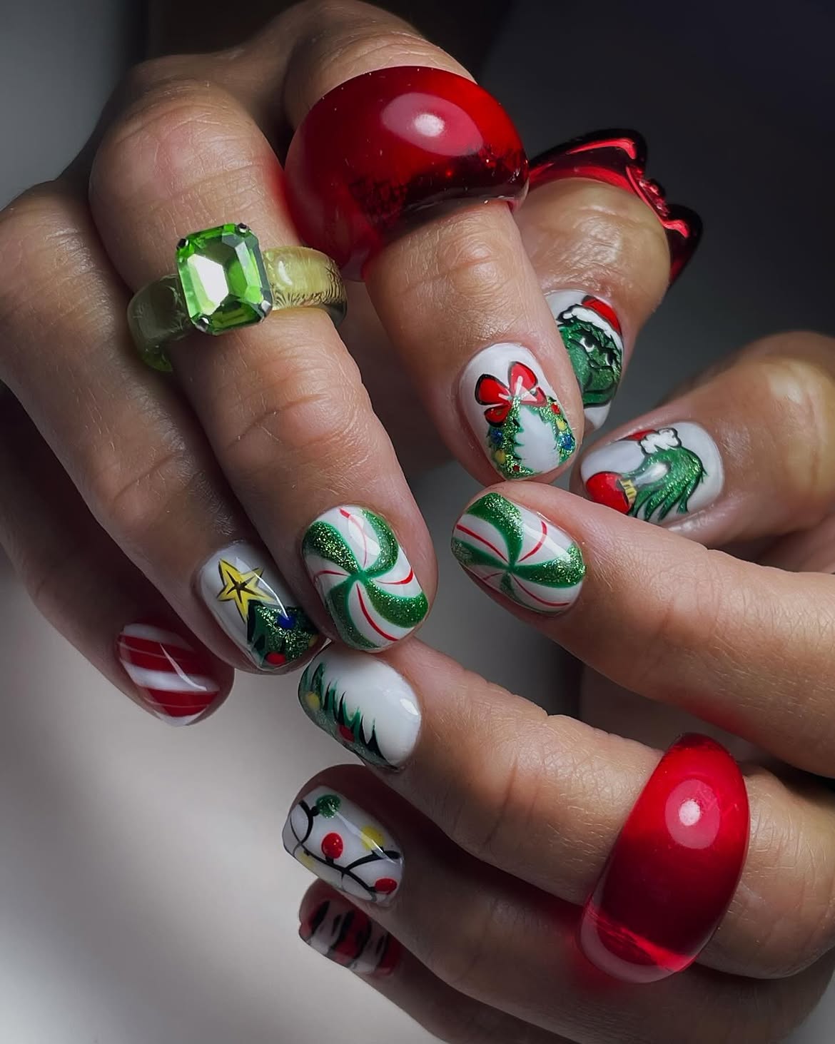 Festive Grinch Nail Art With Peppermint Swirls