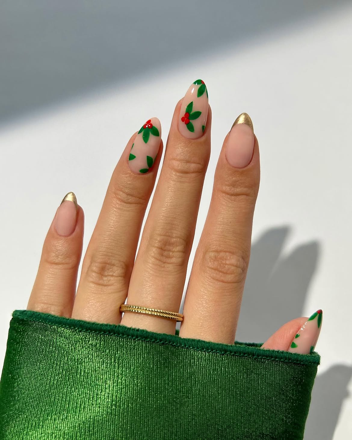 Festive Holly Leaf And Gold French Almond Nails