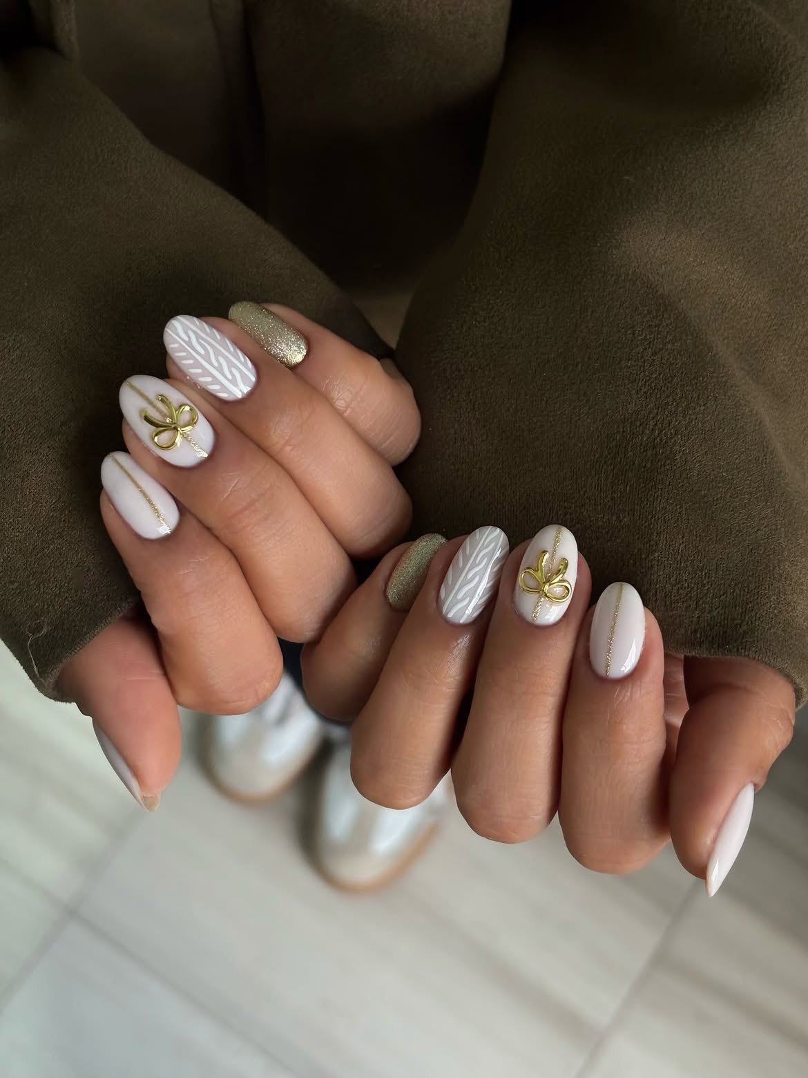 Festive Ivory Knit and Gold Bow Almond Nails