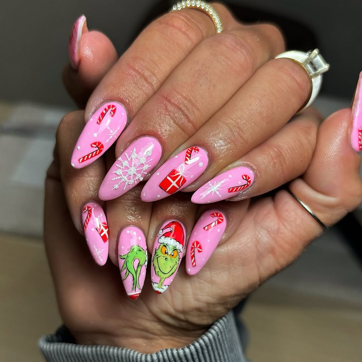 Festive Pink Grinch Almond Nail Art
