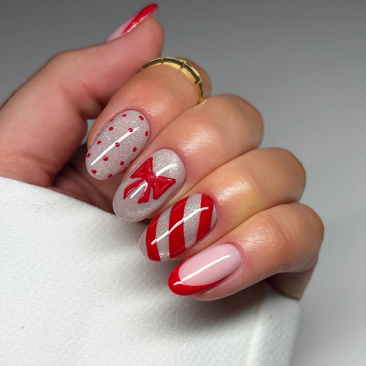 Festive Red Bow And Candy Cane Almond Nails