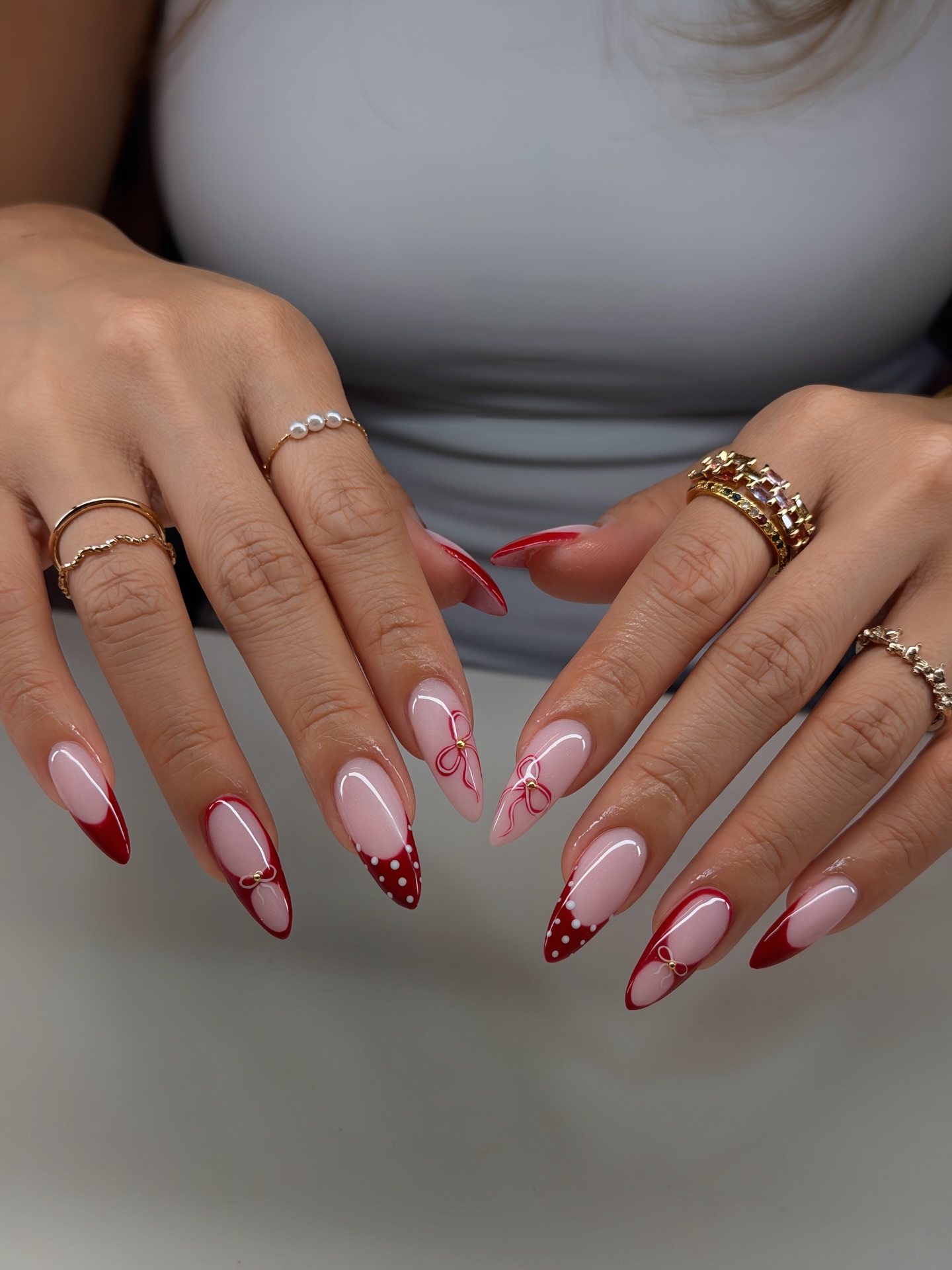 Festive Red French Tip Almond Nails With Bows