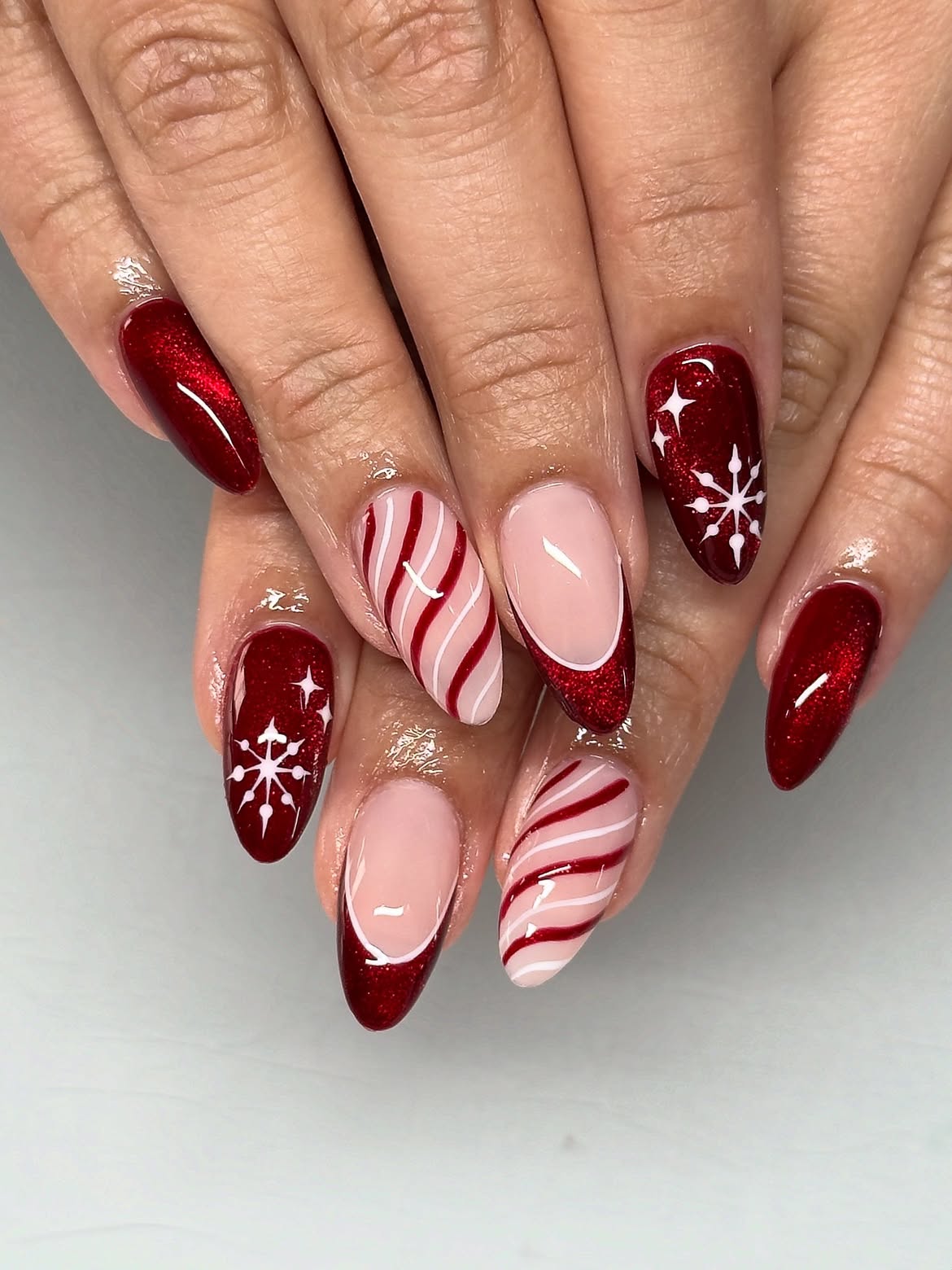 Festive Red Glitter And Candy Cane Almond Nails