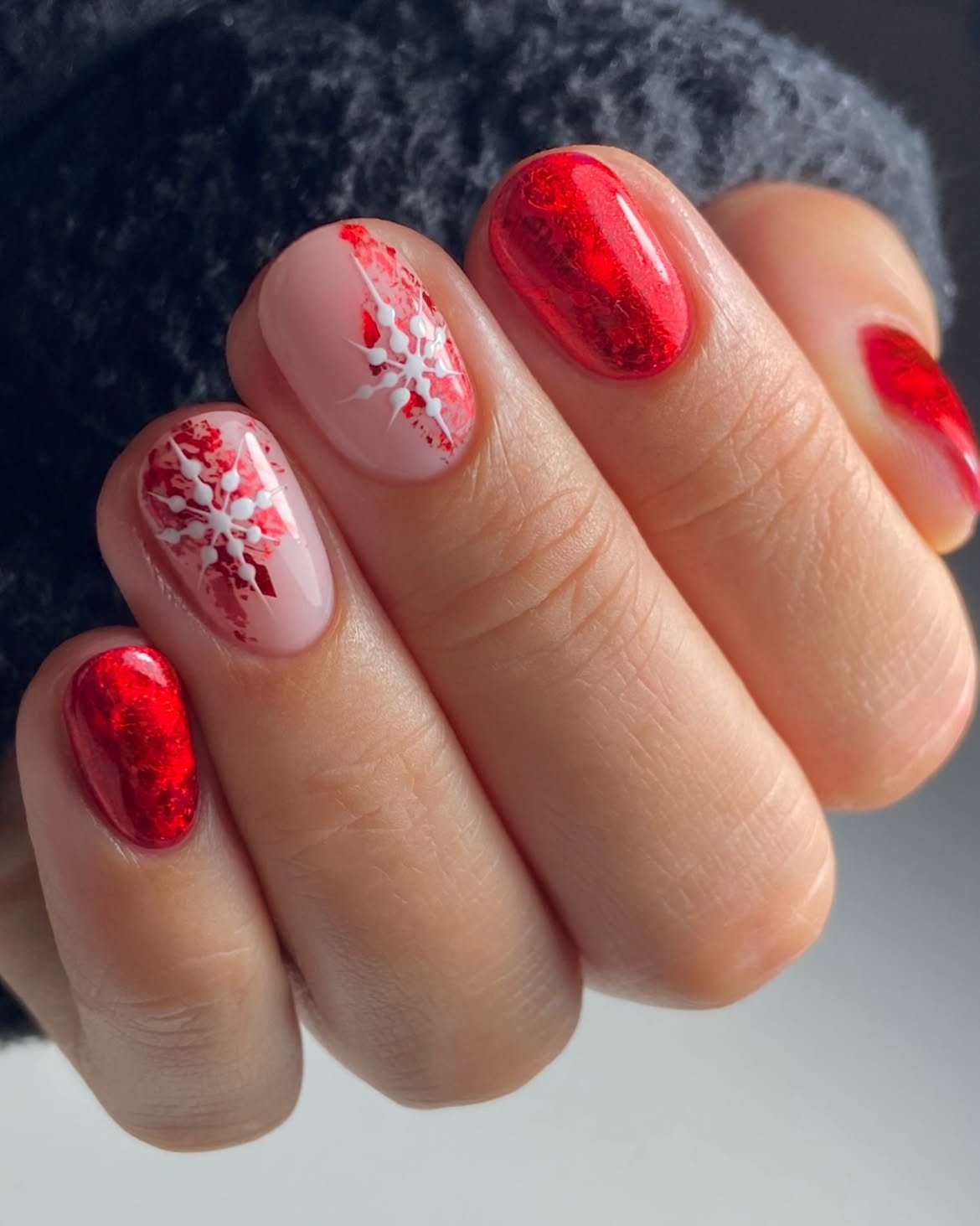 Festive Red Snowflake Oval Nails