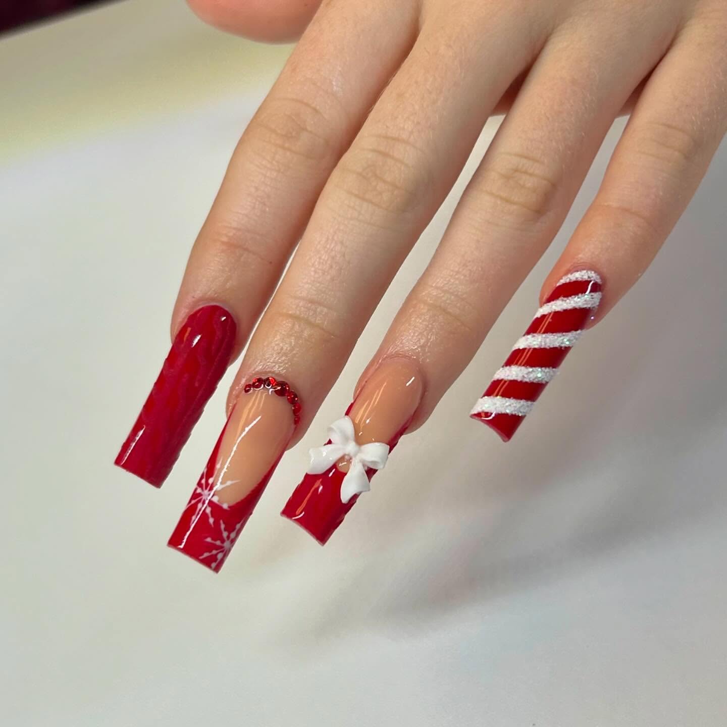 Festive Red & White Candy Cane Christmas Nails