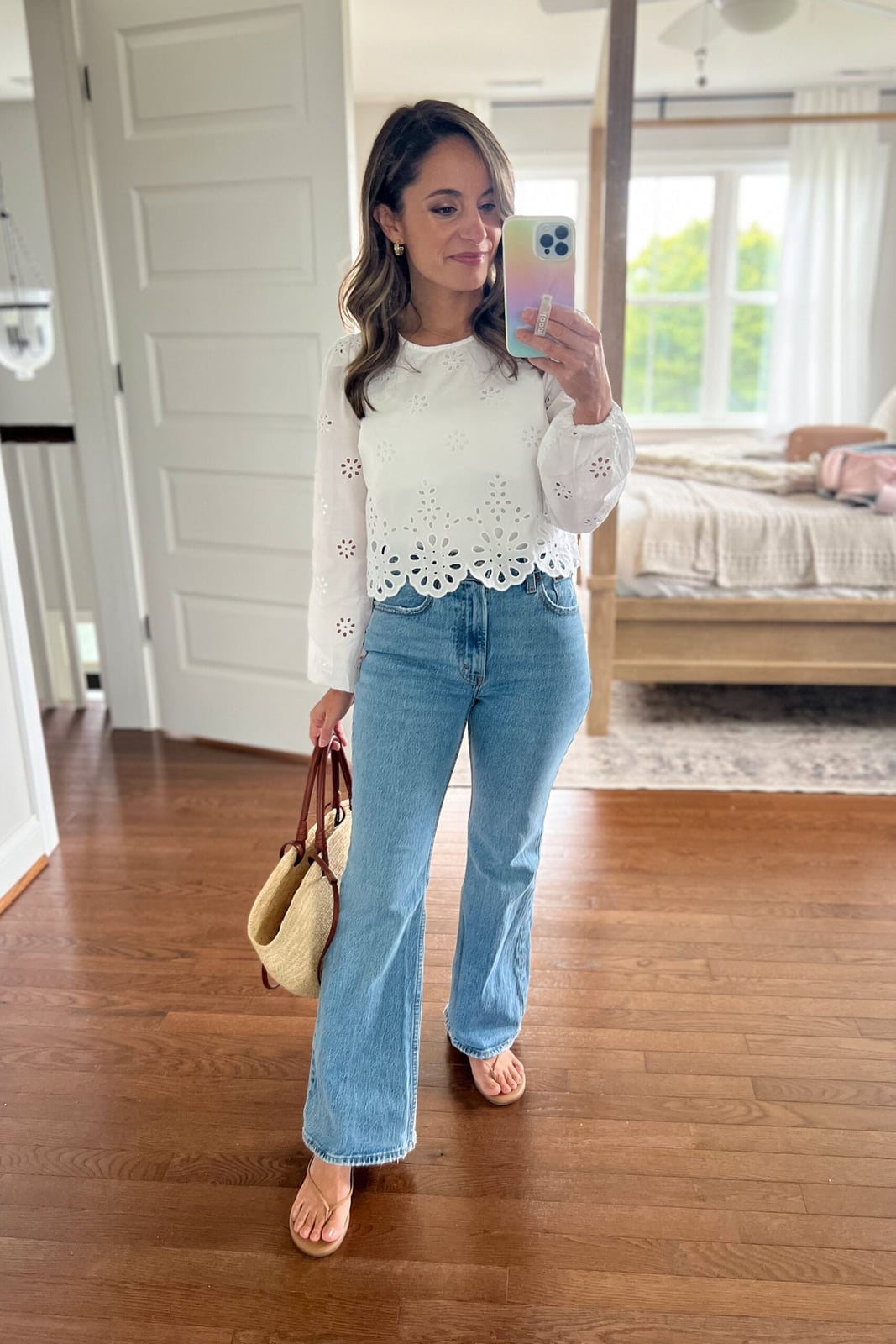 Light wash high-waisted flare jeans with a white eyelet, Close-Up Take Light wash high-waisted flare jeans with a white eyelet, Close-Up Take — Flare Jeans Outfits
