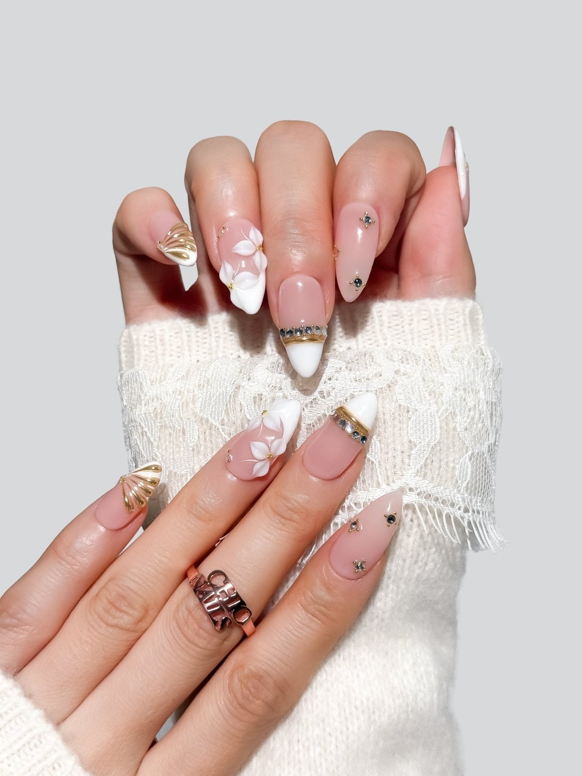 Medium Almond White French Tips with 3D Florals and Gold Accents Medium Almond White French Tips with 3D Florals and Gold Accents — French Tip Nails