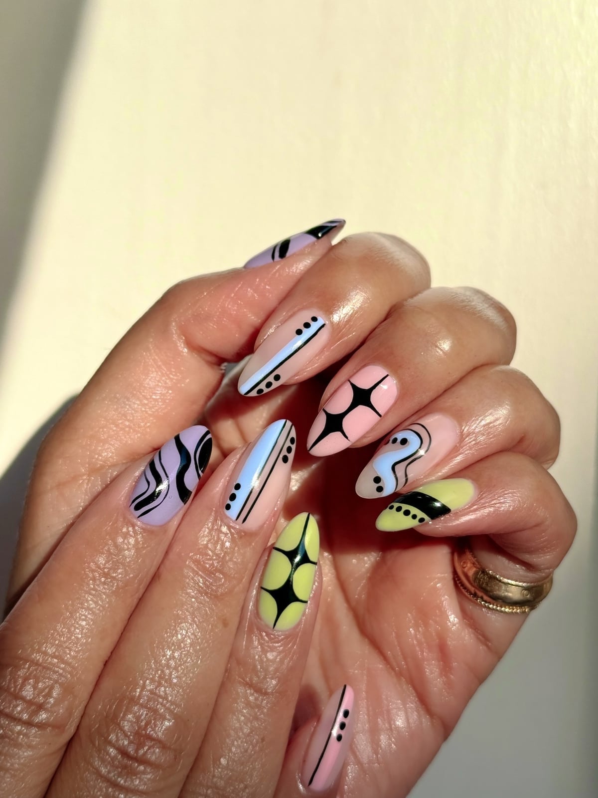 Medium Almond Nails With Pastel Abstract Patterns Medium Almond Nails With Pastel Abstract Patterns — Funky Nails