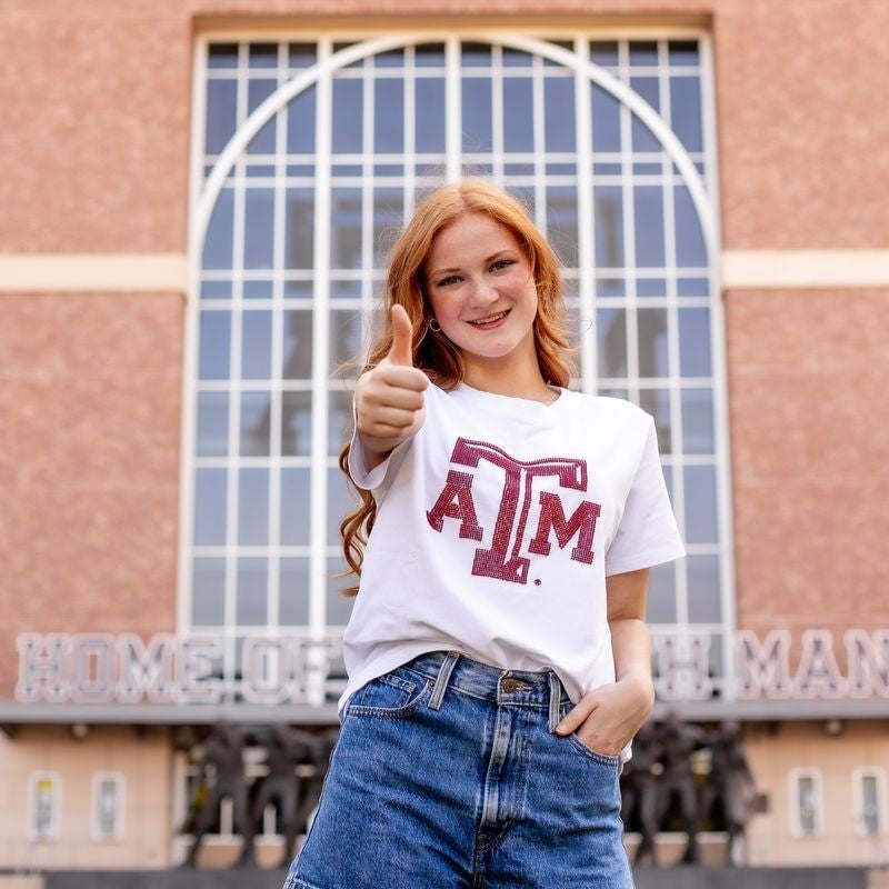 White graphic t-shirt and blue denim shorts White graphic t-shirt and blue denim shorts — Game Day Outfits