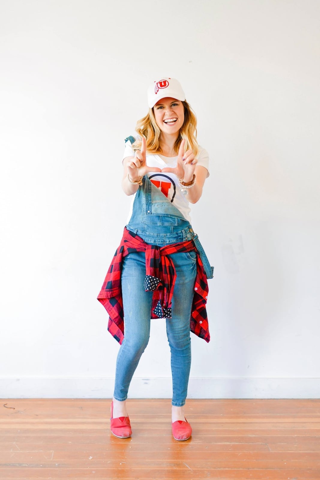 Denim overalls over a white tee with plaid shirt Denim overalls over a white tee with plaid shirt — Game Day Outfits