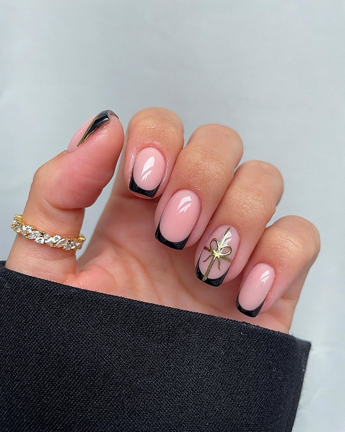 Glossy Black French Tips With Gold Bow