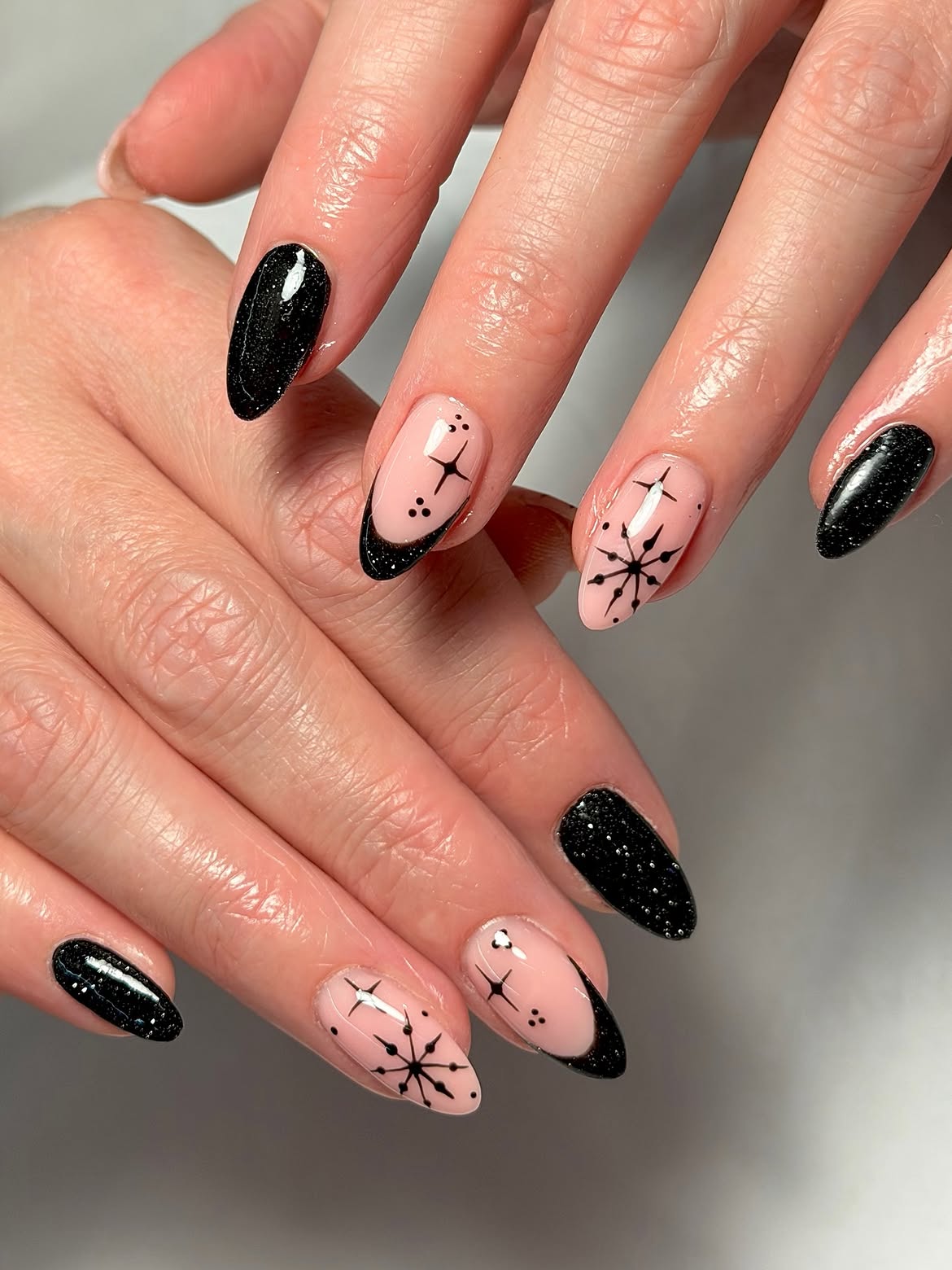 Glossy Black Sparkle Almond Winter Nail Art