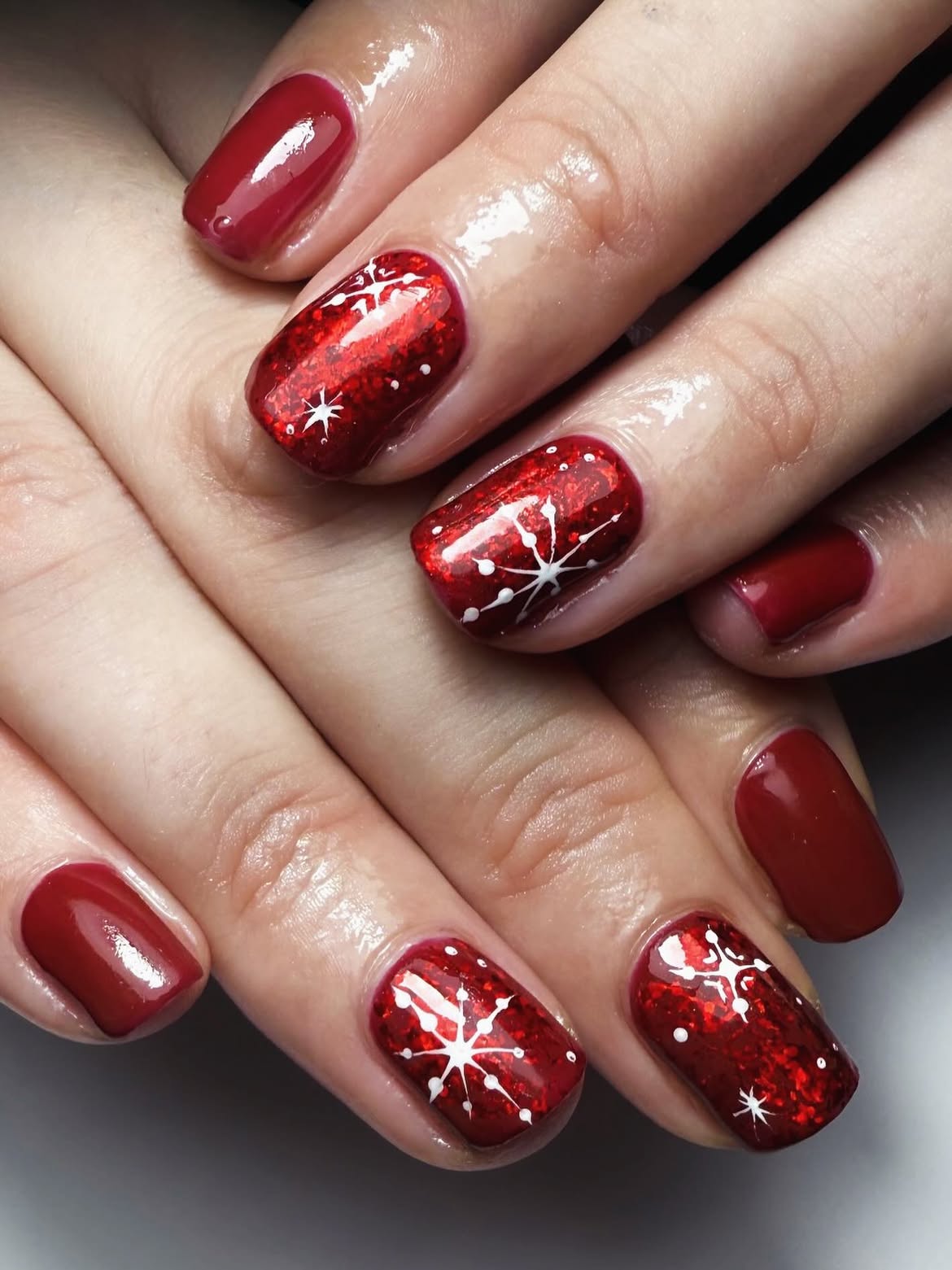 Glossy Crimson Red Winter Snowflake Nails