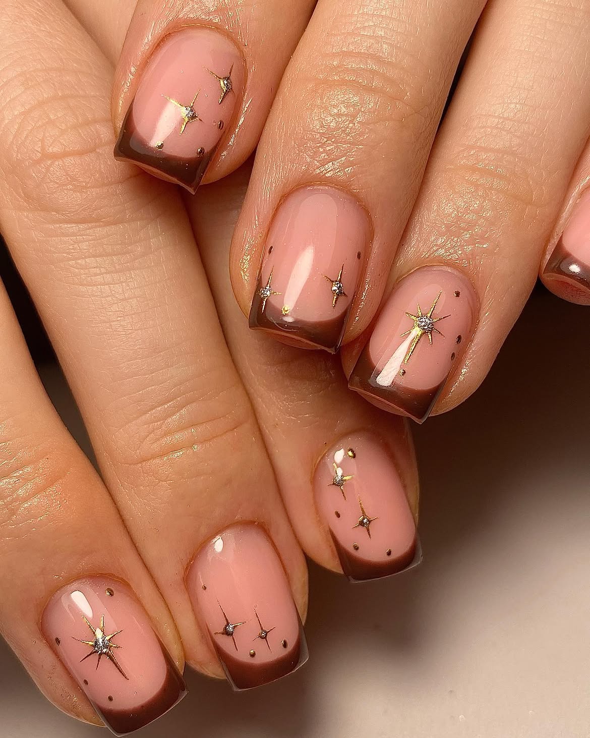 Glossy Dark Brown French Tips With Gold Celestial Stars