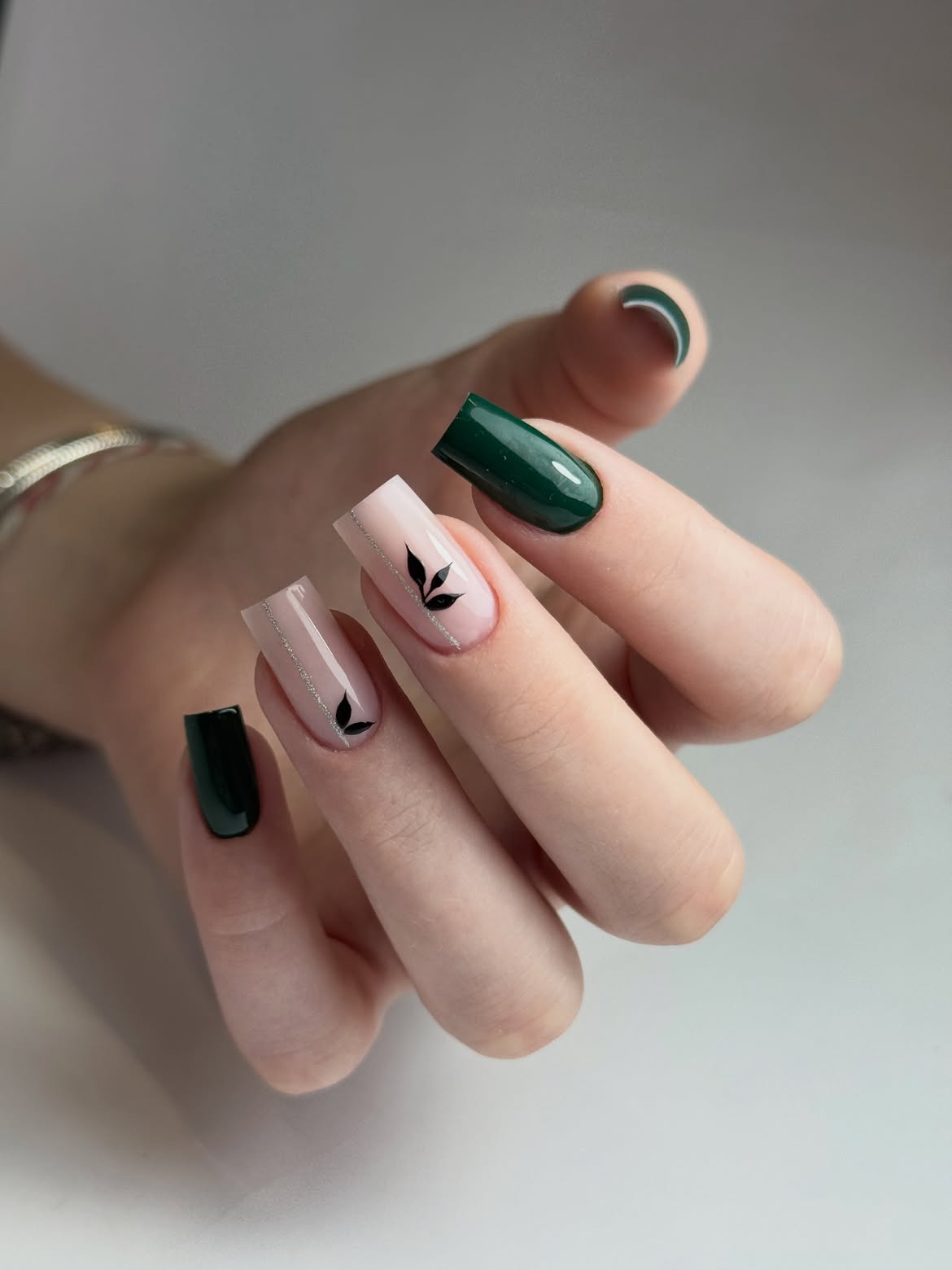 Glossy Dark Green And Nude Leaf Nail Art