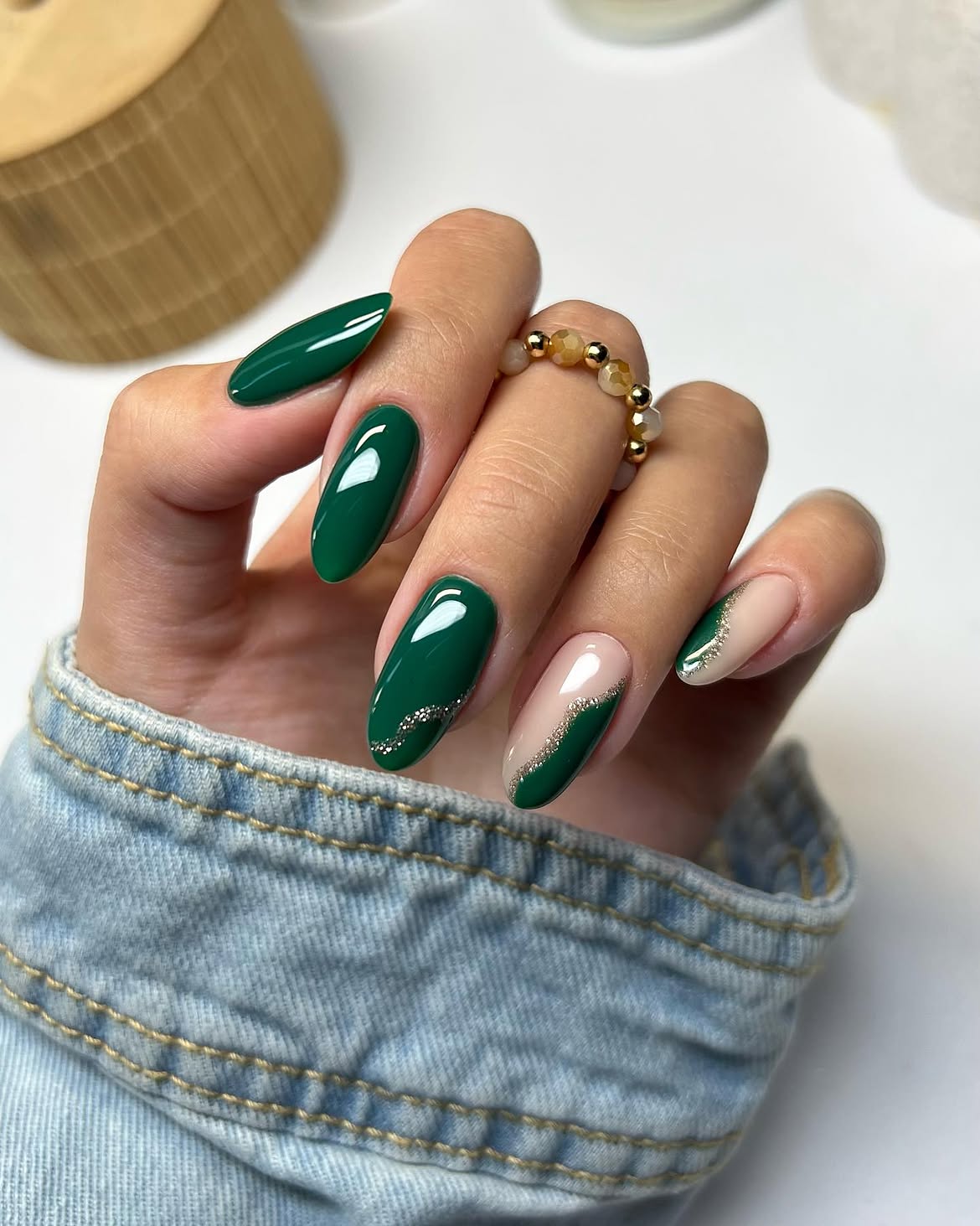 Glossy Dark Green And Nude Swirl Almond Nails