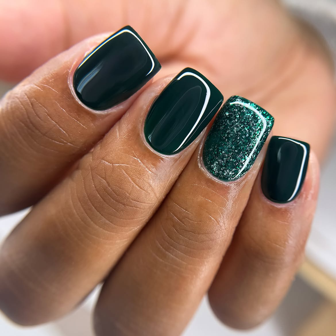Glossy Dark Green Nails With Glitter Accent