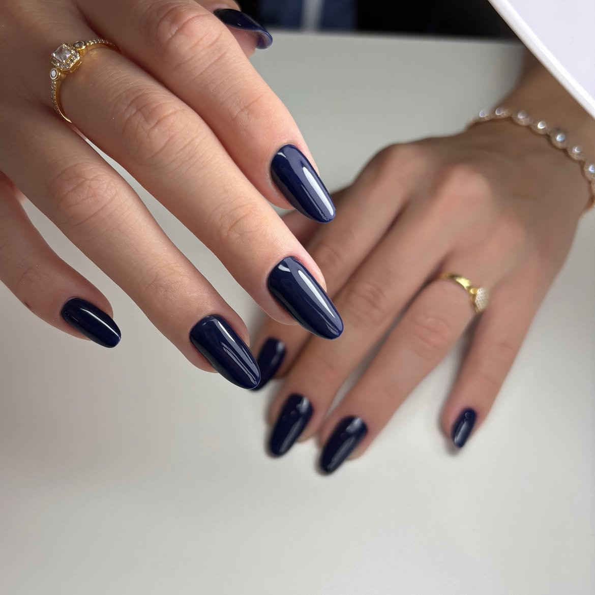 Glossy Deep Navy Blue Almond Nails