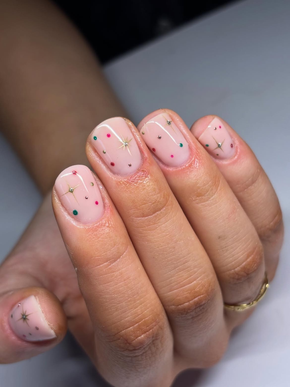 Glossy Milky Pink Nails With Starbursts And Rhinestones