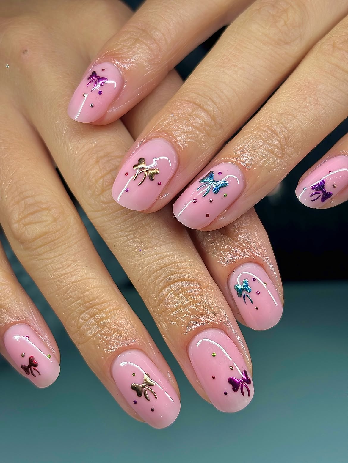 Glossy Pastel Pink Nails With Metallic 3D Bows