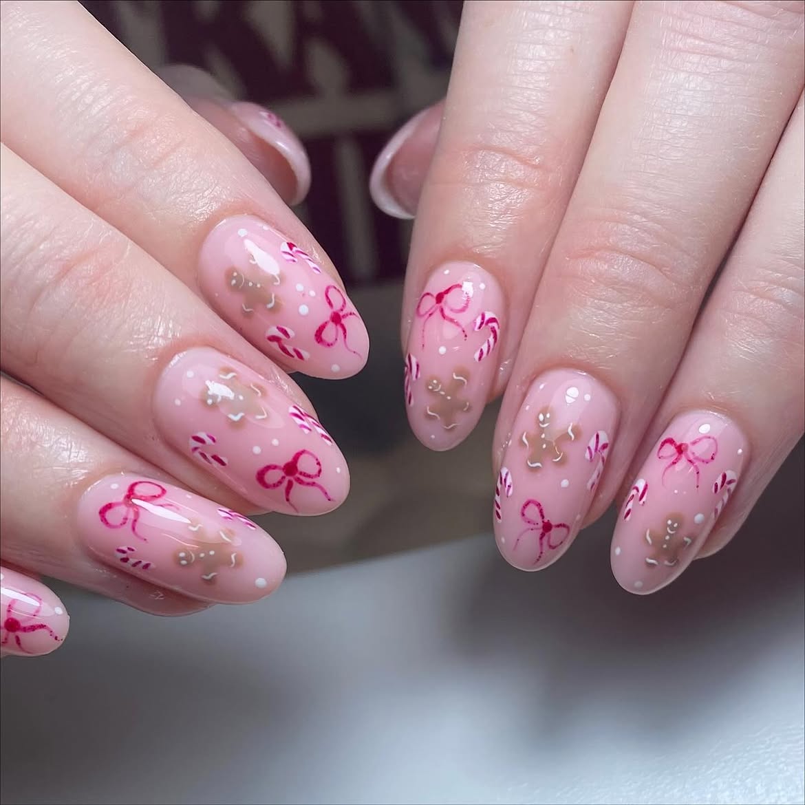 Glossy Pink Gingerbread And Bow Christmas Nails