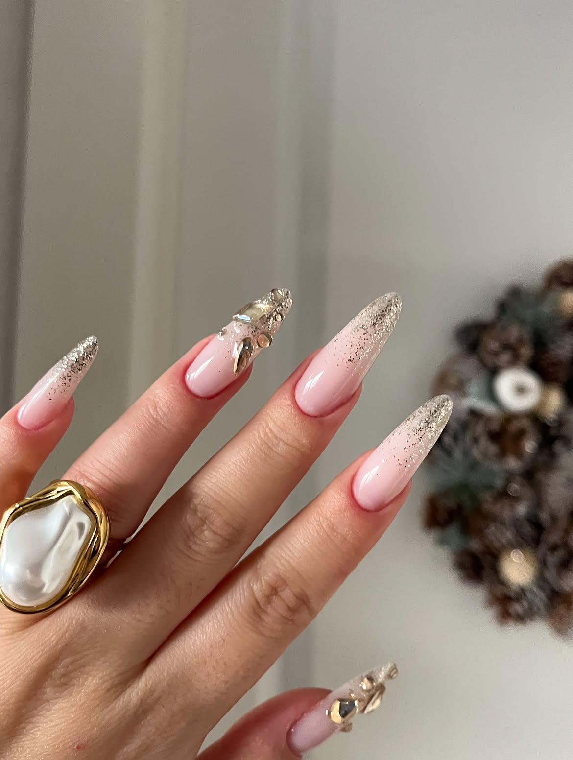 Glossy Pink Stiletto Nails with Silver Glitter and Rhinestones