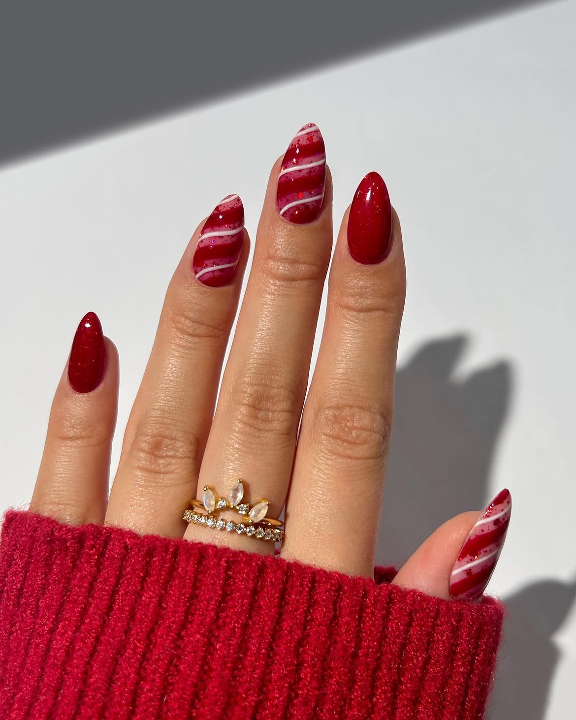 Glossy Red Candy Cane Swirl Almond Nails