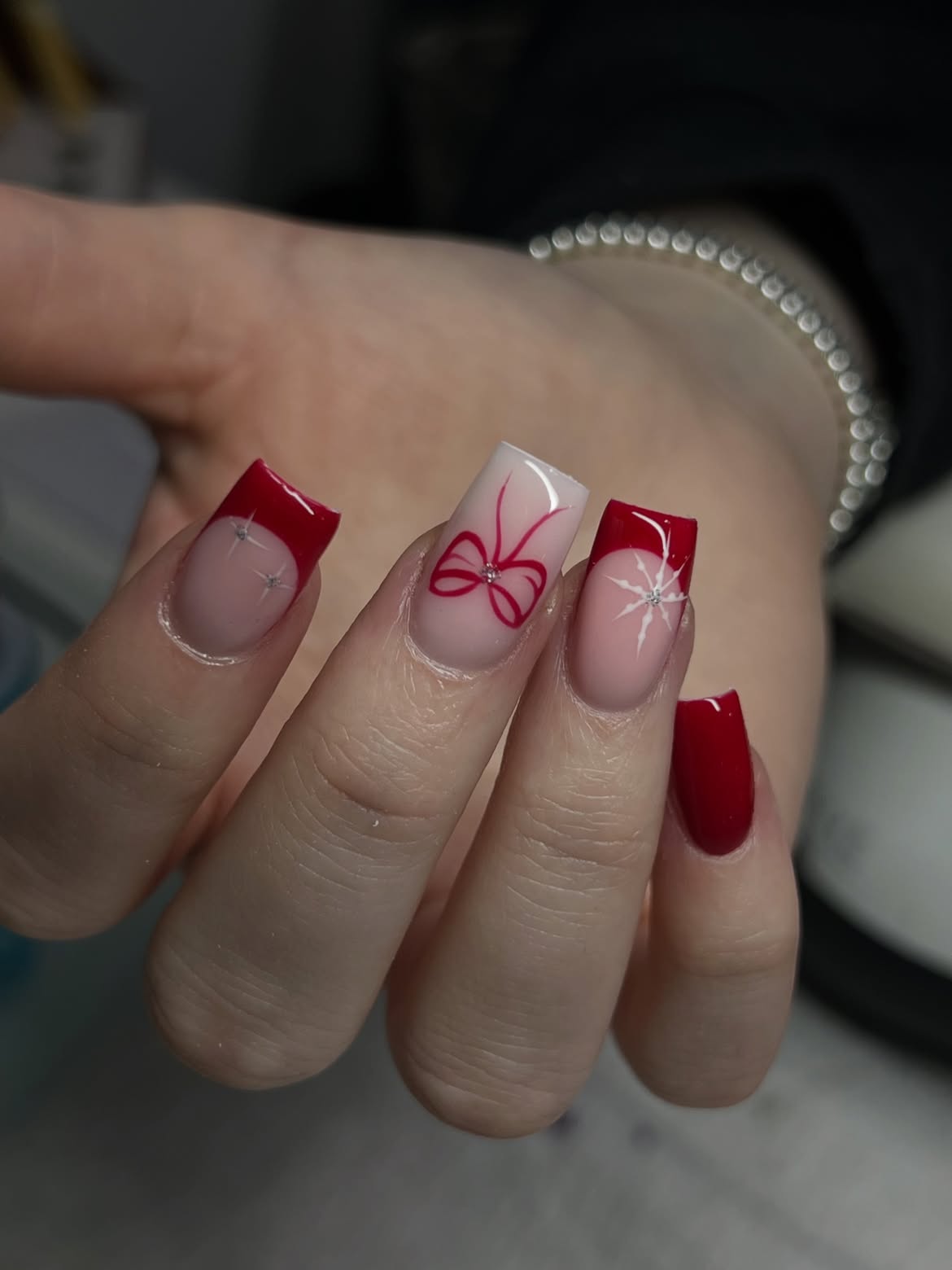Glossy Red French Tips With Christmas Bow Accent Nails