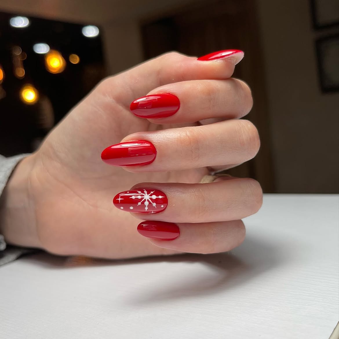 Glossy Red Winter Nails With Snowflake Art