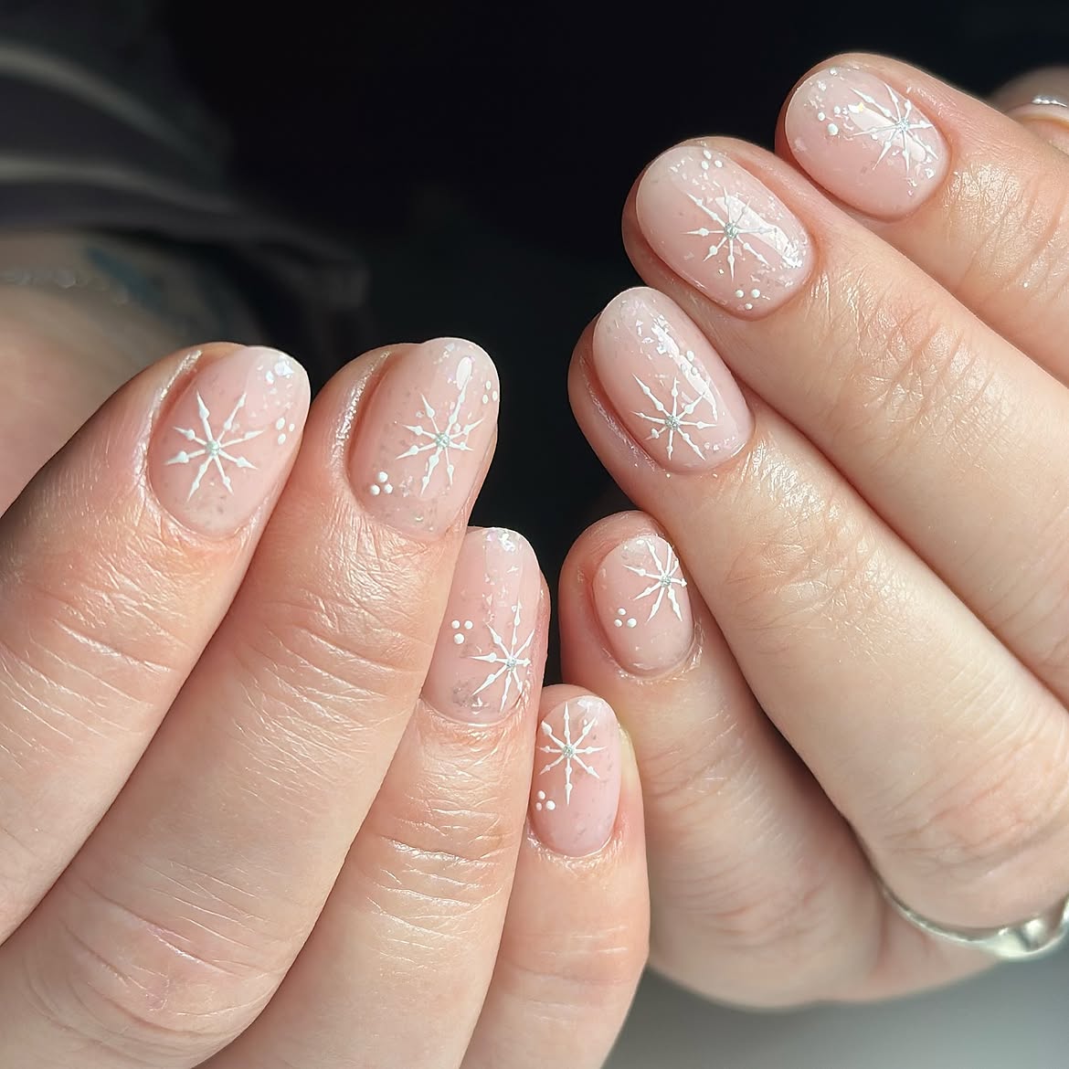 Glossy Snowflake Nail Art On Milky Nude Base