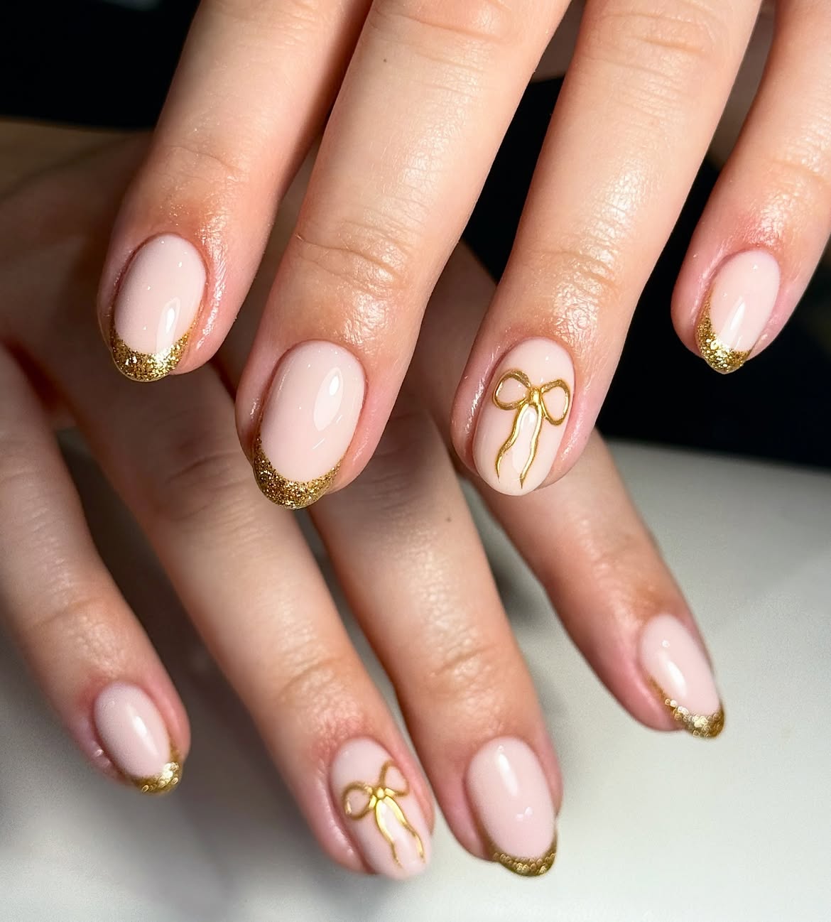 Gold Glitter French Tip Bow Nails