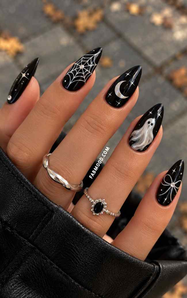 Glossy Black Stiletto Nails with Halloween Motifs Glossy Black Stiletto Nails with Halloween Motifs — Gothic Nails