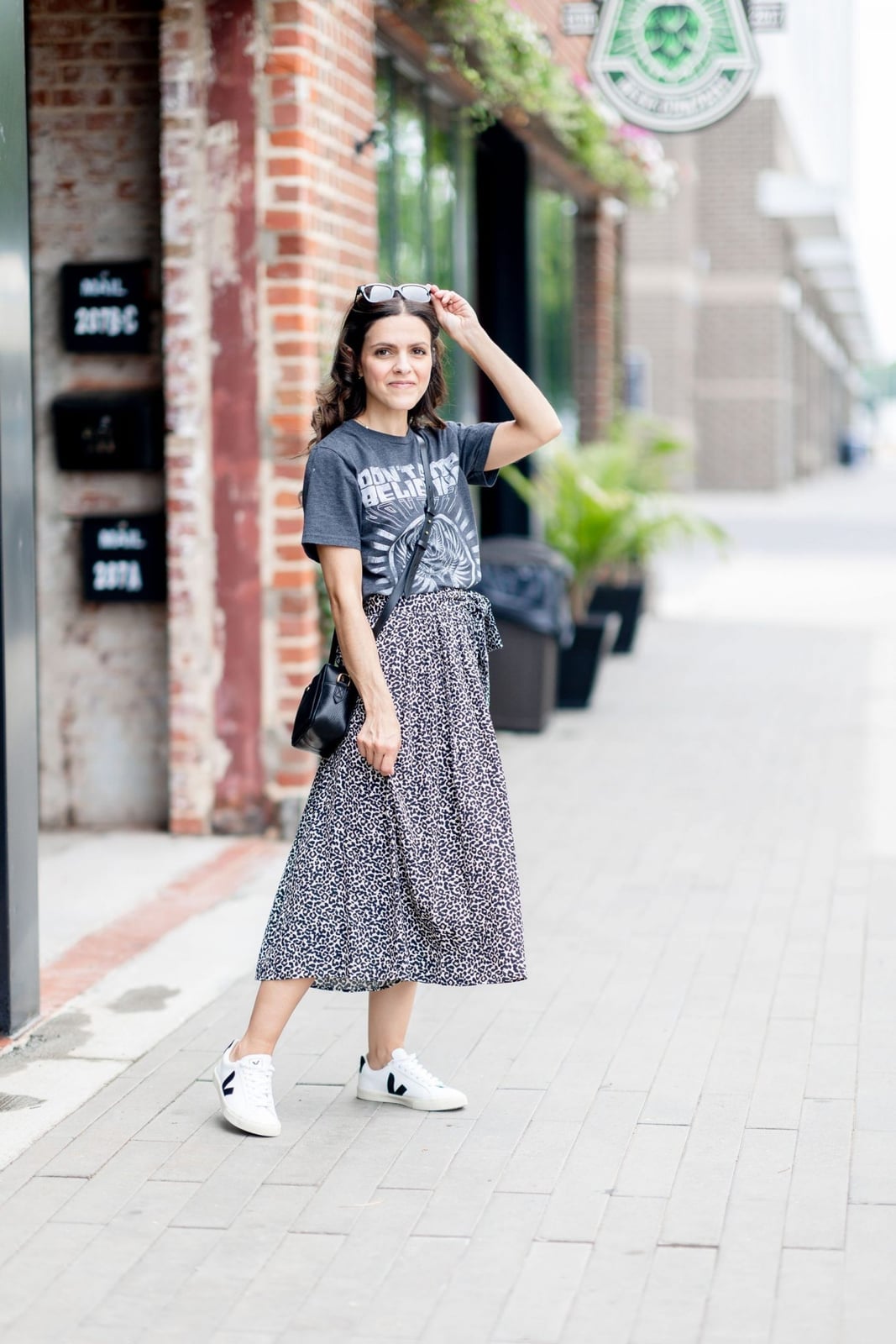 Graphic Tee With Patterned Midi Skirt And White Sneakers Graphic Tee With Patterned Midi Skirt And White Sneakers — Graphic Tee Outfits