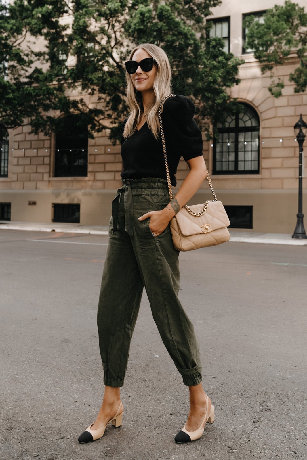 Olive green paperbag waist trousers with a black top Olive green paperbag waist trousers with a black top — Green Pants Outfits