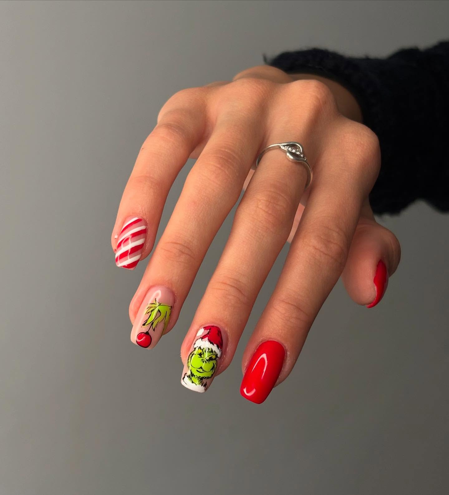 Grinch Christmas Nail Art with Candy Cane Accents