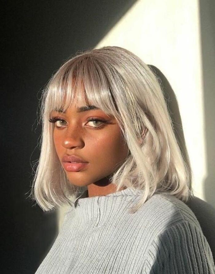 High Bun With Coily Locs High Bun With Coily Locs — Haircuts for Black Women