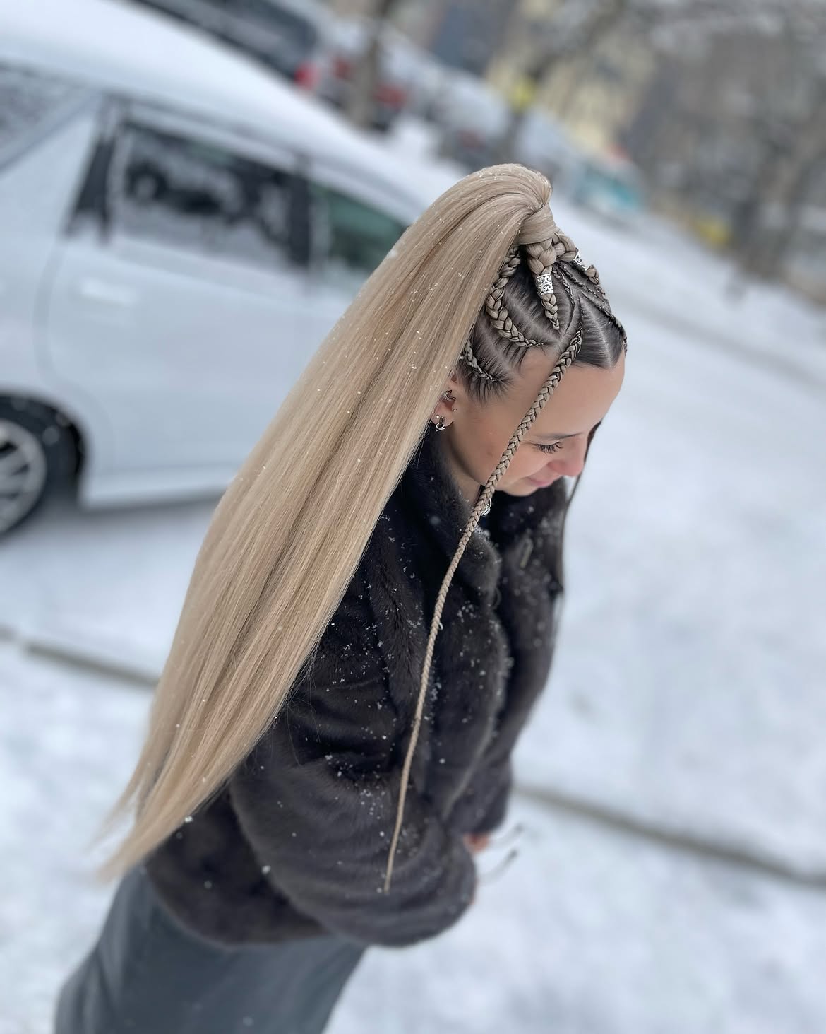 High Ponytail With Intricate Scalp Braids And Silver Cuffs