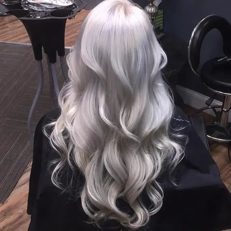 Mid-Back Length Thick Wavy Platinum Blonde, Showcasing A Glossy Mid-Back Length Thick Wavy Platinum Blonde, Showcasing A Glossy — Icy Blonde