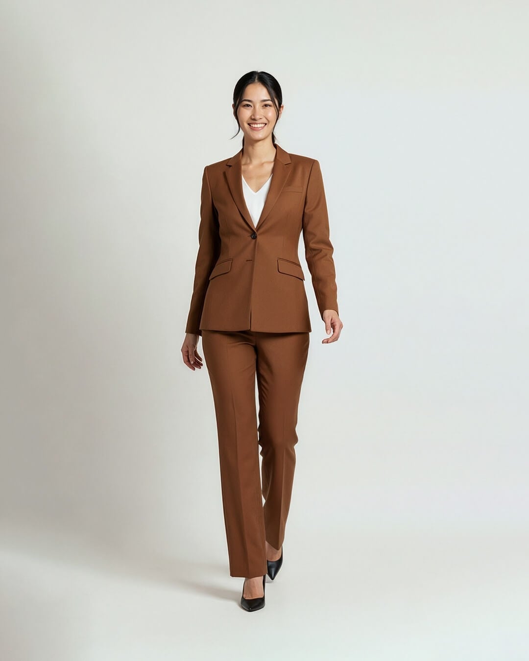 Rich brown suit with white v-neck top Rich brown suit with white v-neck top — Interview Outfits