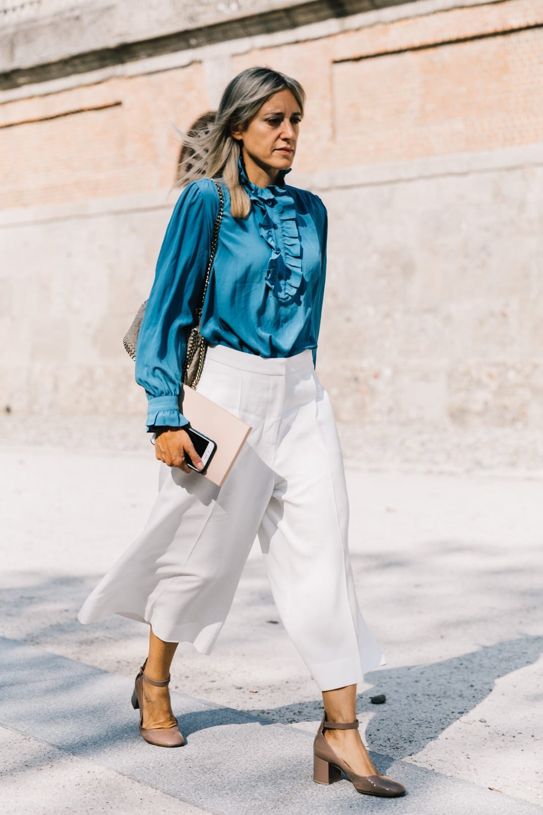 Bright blue ruffled blouse with white culottes Bright blue ruffled blouse with white culottes — Interview Outfits