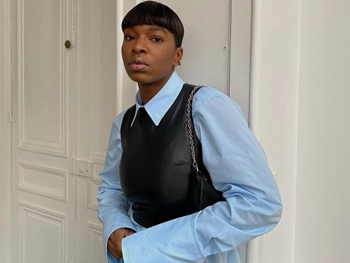 Faux leather vest over a light blue shirt Faux leather vest over a light blue shirt — Interview Outfits