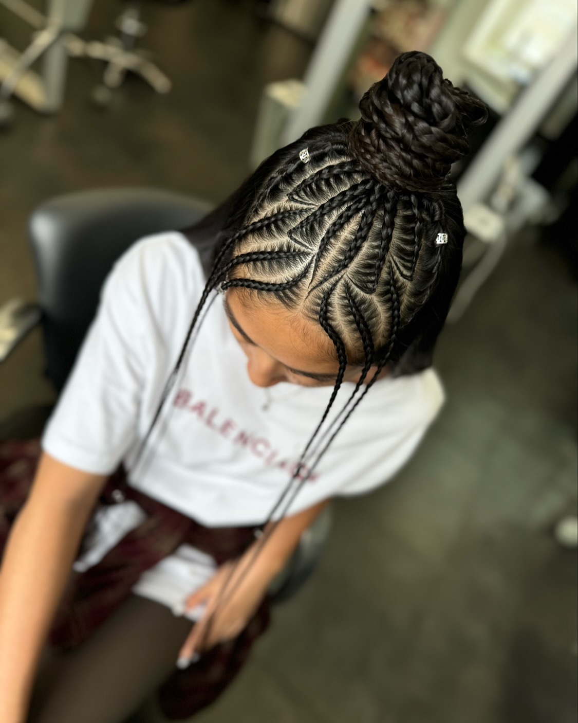 Intricate Geometric Cornrow Top Knot With Face Framing Tendrils