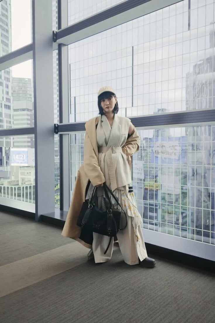 Classic beige trench coat and belted vest layers Classic beige trench coat and belted vest layers — Japan Outfits