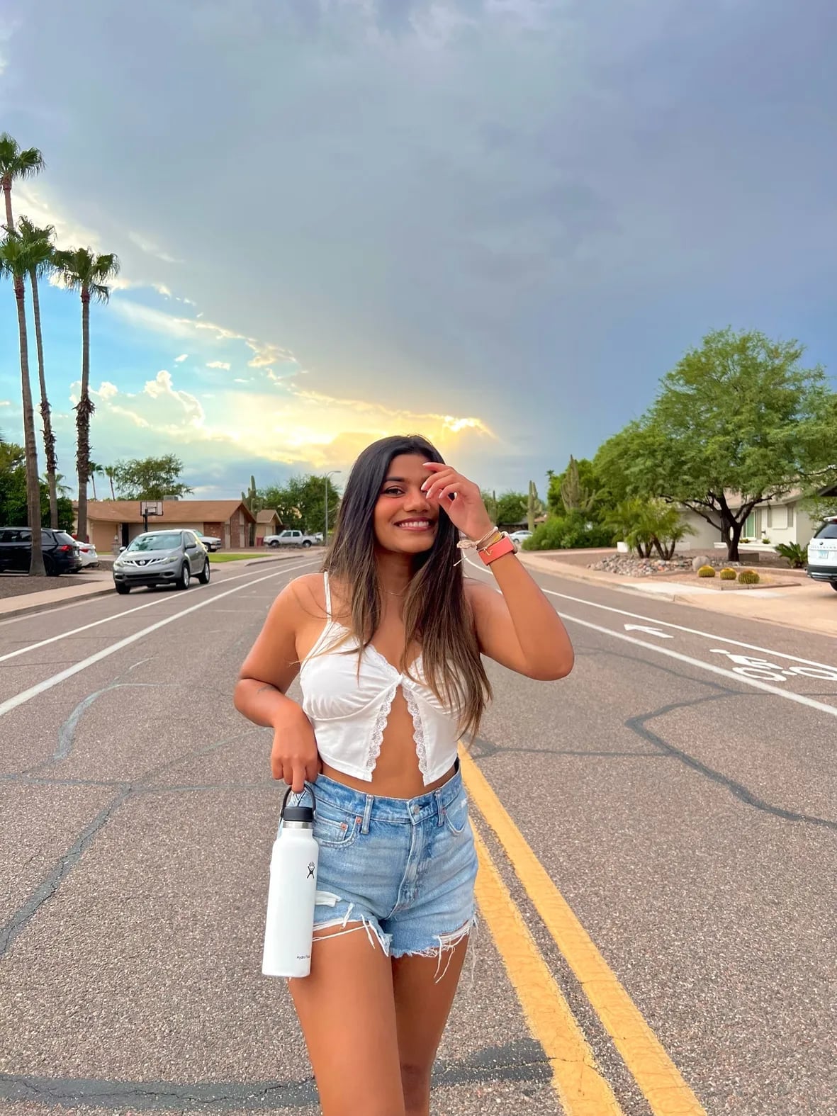 Distressed denim shorts with a lace-trimmed white top Distressed denim shorts with a lace-trimmed white top — Jean Shorts Outfits