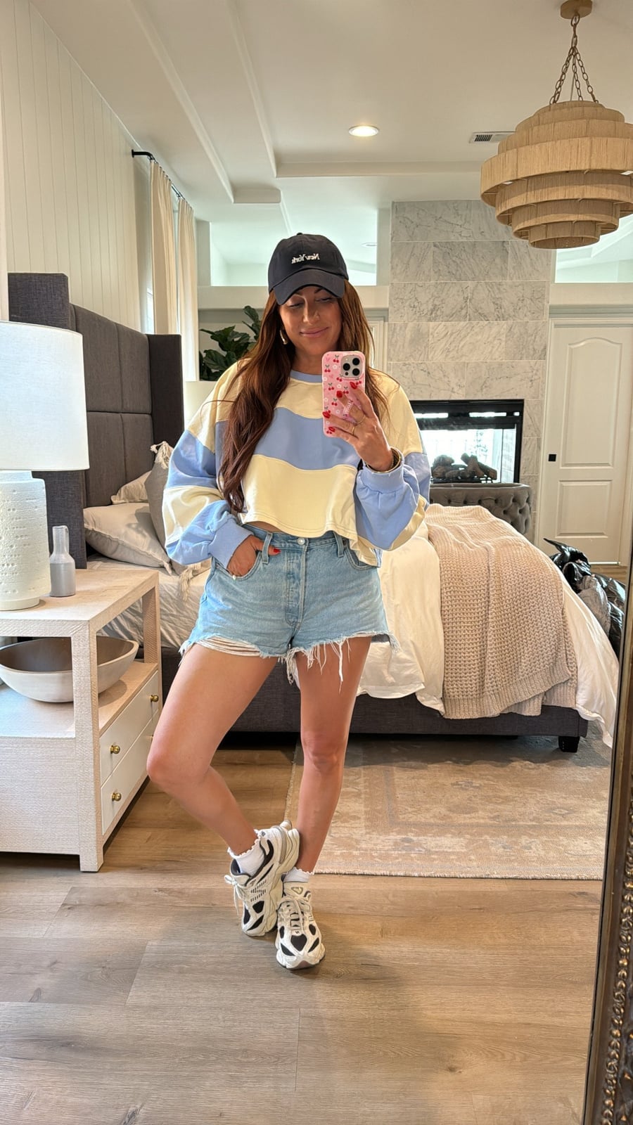 Light-wash distressed denim shorts with a pastel sweatshirt Light-wash distressed denim shorts with a pastel sweatshirt — Jean Shorts Outfits