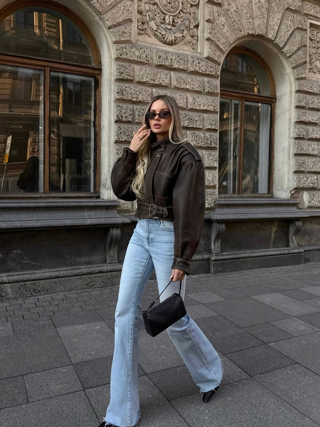 Light wash flared jeans with a white top and brown textured jacket Light wash flared jeans with a white top and brown textured jacket — Jeans Outfits